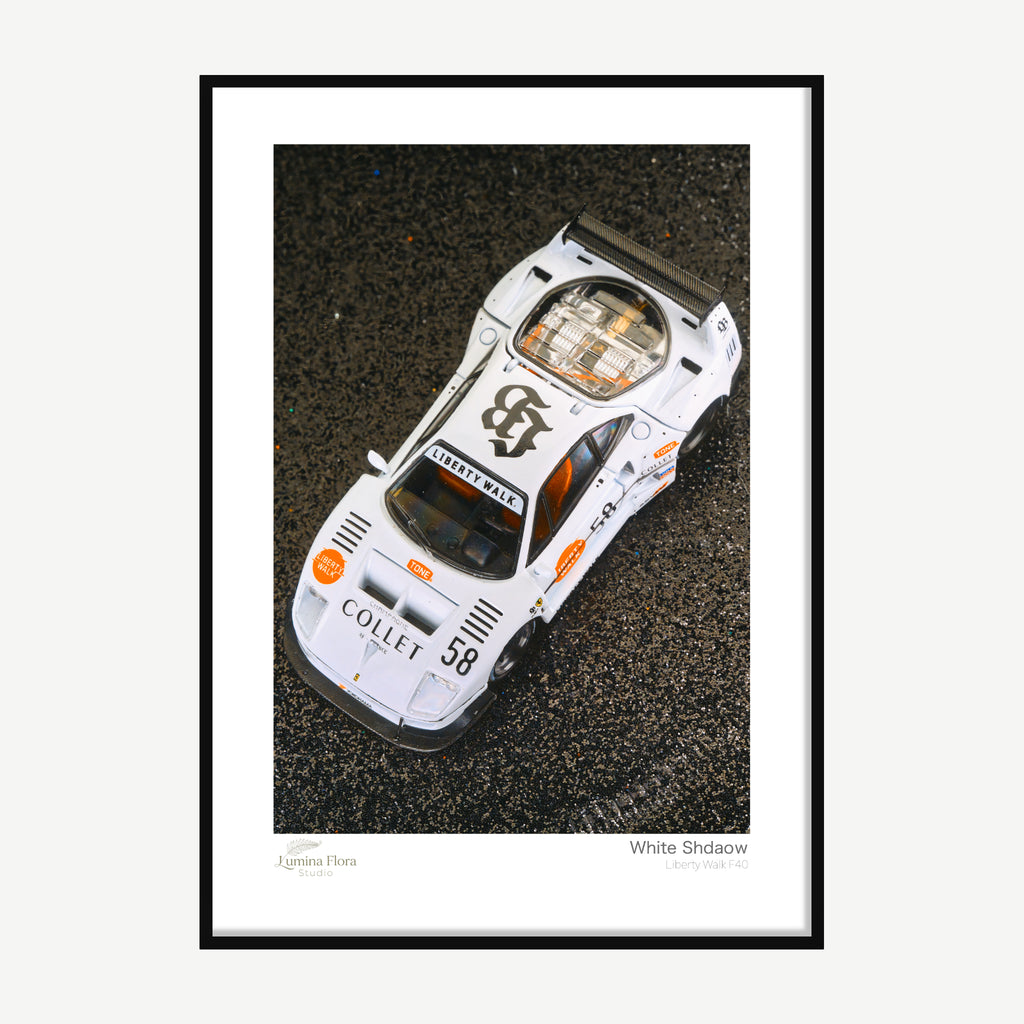 Framed print: overhead view of a white 1/64 widebody model car, black wood frame