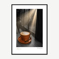 Framed print: steaming coffee cup lit by morning sunlight through a window, black wood frame