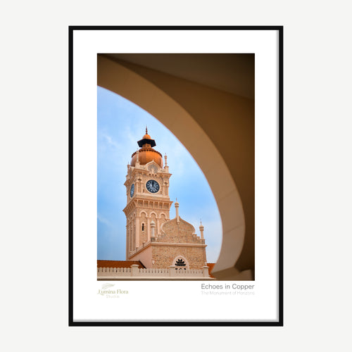 Framed print: heritage clocktower with copper domes seen through an archway, black wood frame