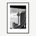 Framed print: black and white KL Tower beside a modern high-rise, black wood frame