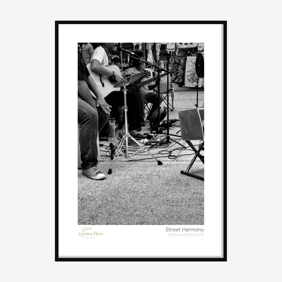 Framed print: black and white photo of three street musicians playing, black wood frame