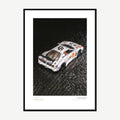 Framed print: macro of a 1/64 widebody supercar model, black wood frame