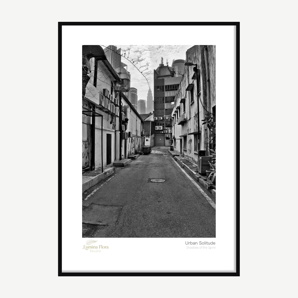 Framed print: black and white alleyway with a distant tower spire, black wood frame