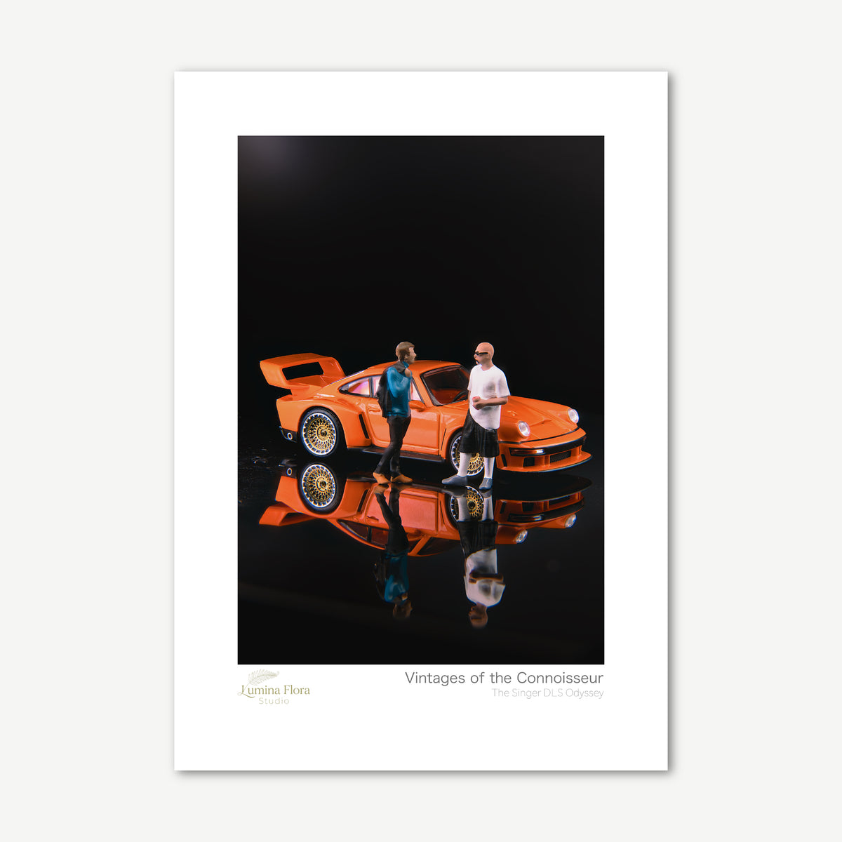 Unframed print: miniature figures beside an orange classic car, white gallery border